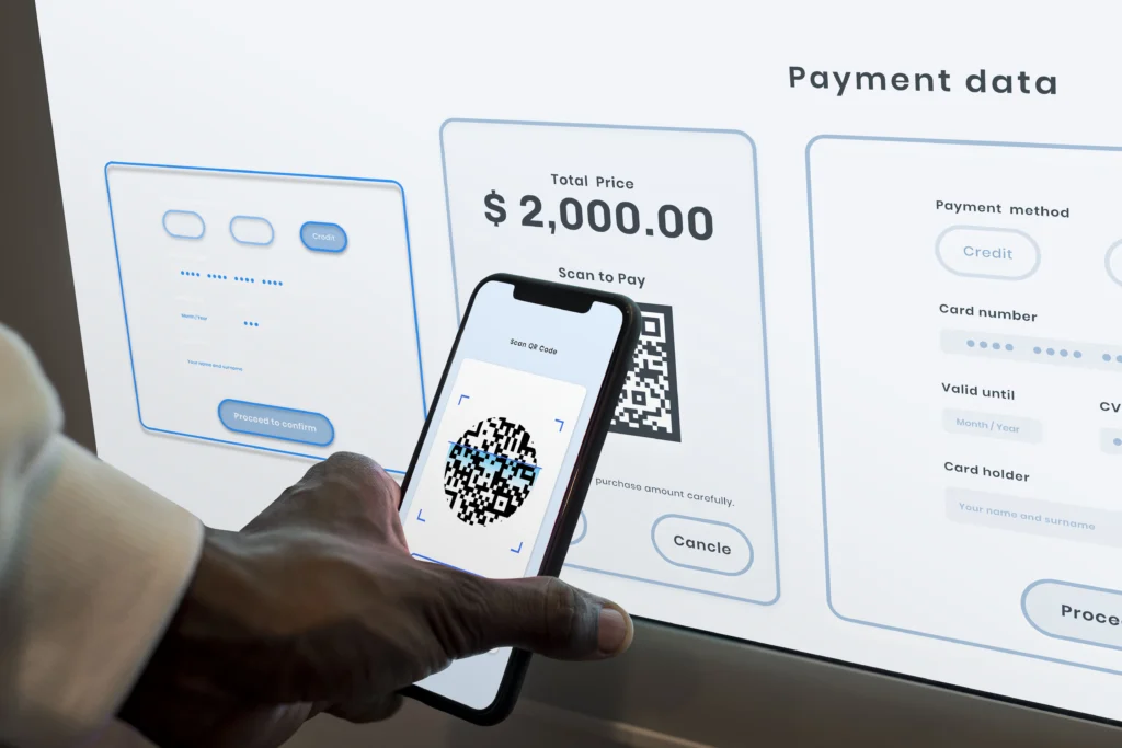 A person using a smartphone to complete a mobile payment for a product at a retail store.